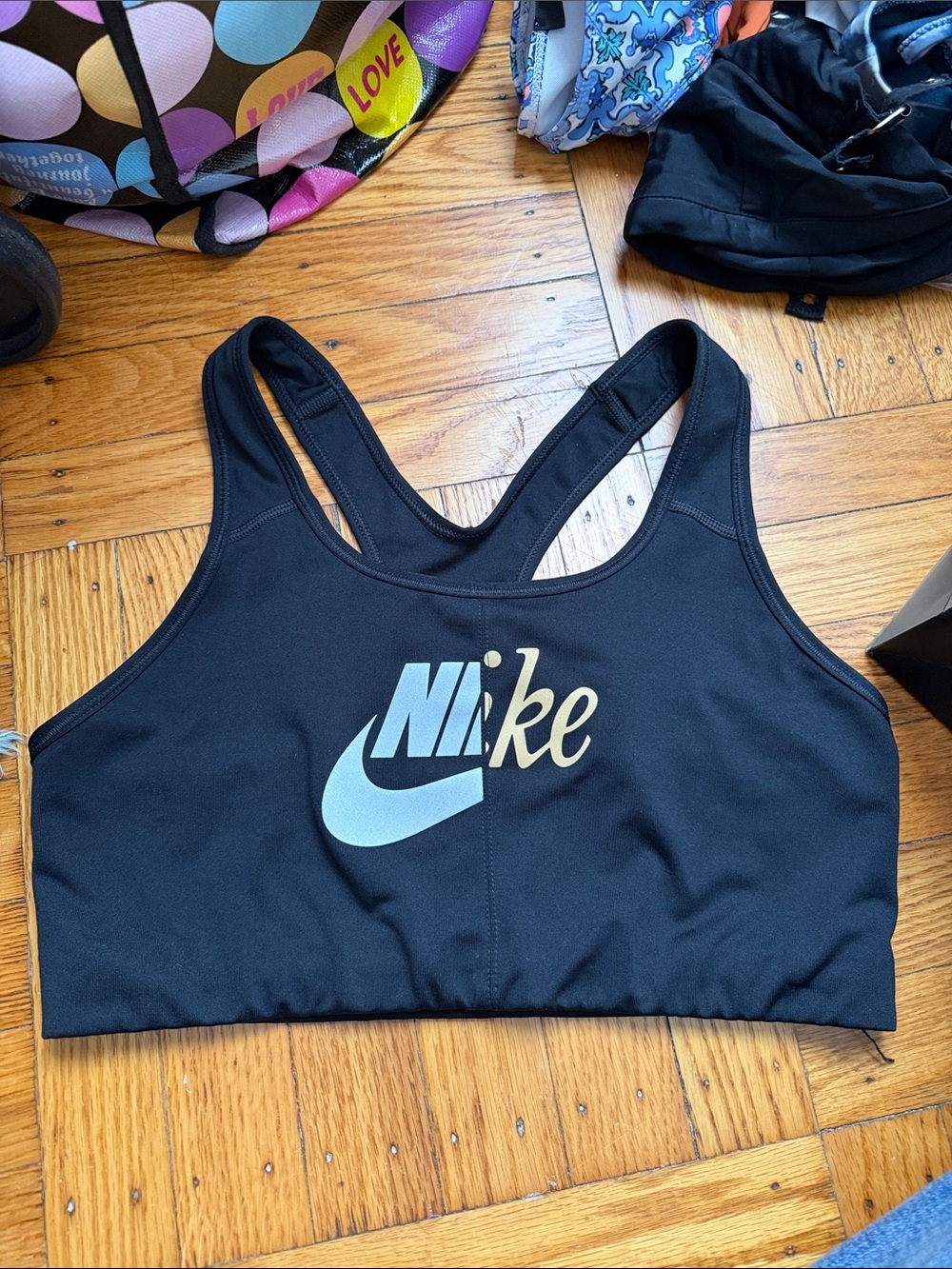 Nike Black Sports Bra with silver & Gold Logo - size Large